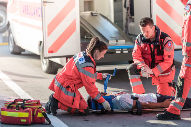 istock Rescue Team Helping Victim Of Car Crash 1127601234