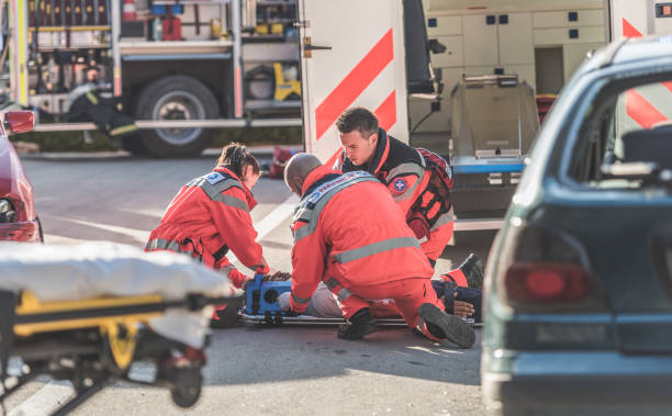 istock Rescue Team Helping Victim Of Car Crash 1127601252