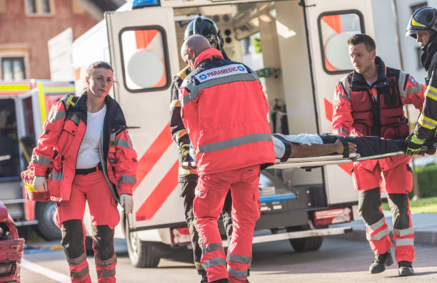 istock Rescue Team Helping Victim Of Car Crash 1127601267