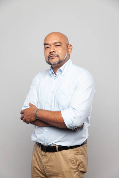 istock Indian male portrait confident bossy proud look expression folding arms 1127601324