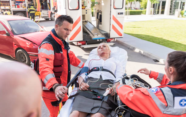 istock Paramedic Team Helping Injured Woman 1127601326