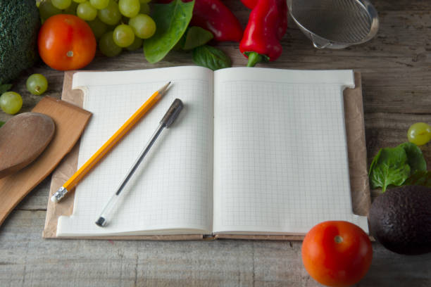 istock Fresh organic vegetables, wooden background and paper for Notes. Open notebook and fresh vegetables background. Dieting concept. Copy space. Flat lay. 1127601452