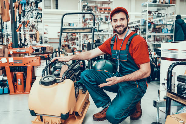 istock Salesman with Plate Compactor in Power Tools Store 1127602144