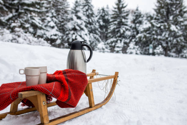 istock Mugs, blanket, sleighs on a snowy day 1127602201