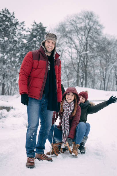 istock Friends having fun on a snowy day 1127602462