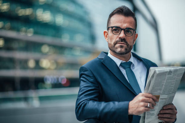 istock Businessman reading newspaper 1127602900