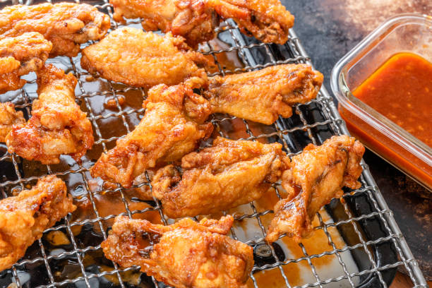 Fried Chicken Wings in Gochujang sauce Deep fried chicken wings in korean style, gochujang sauce CHICKEN Wings stock pictures, royalty-free photos & images