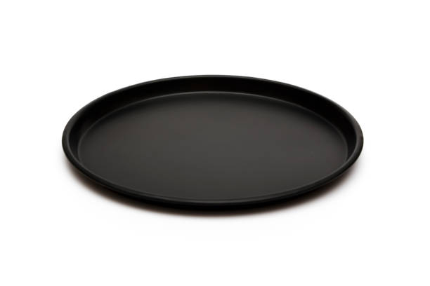 istock Black dish isolated on white background. A mockup of black dishes on a white background. View from above. 1127604265