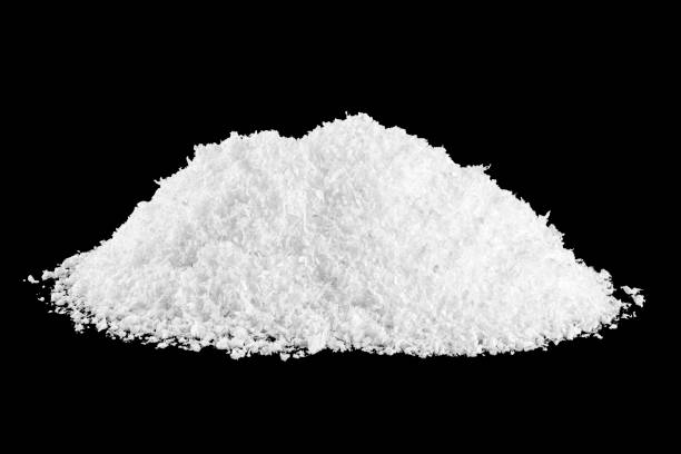Pile of white snow isolated on black background