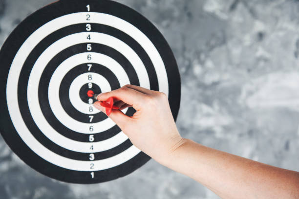 istock woman hand darts 1127604371