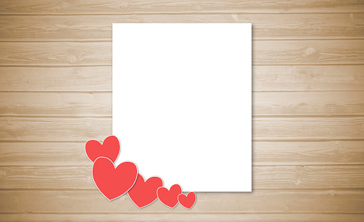 Valentine's day love letter with hearts on wooden background with empty space for your text.