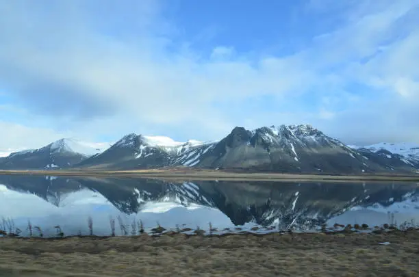 Mirror image of Rhyolite mountains on Snaefellsnes Peninsula in Iceland.