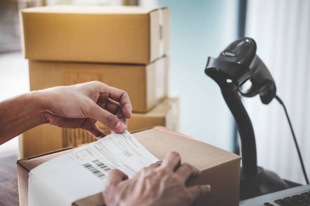 istock Home delivery service and working service mind, Woman working install serial barcode to confirm before sending customer in post office 1127612470
