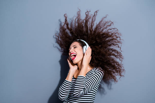 istock Side profile close up photo rejoicing pretty attractive delightful glad nice optimistic in casual pullover using head phones isolated grey background 1127614379