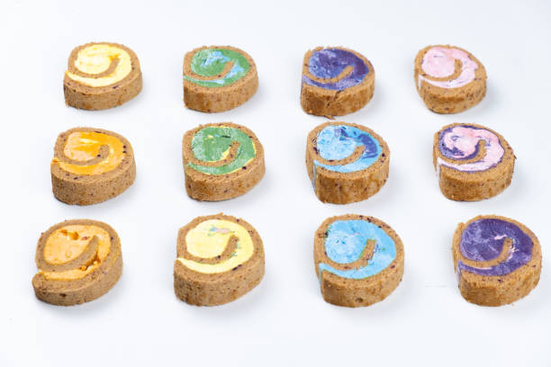istock Delicious creamy colourful minimal cake roll on white background. 1127614522