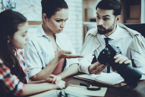 istock Detective with Clients in Private Detective Agency 1127614549