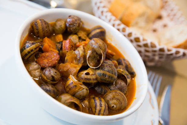 istock Homemade stewed escargots with chorizo 1127614777