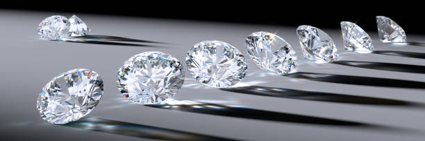 istock Close-up round diamonds with shadows, caustics, on gray background 1127614790