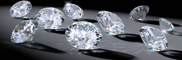 istock Close-up round diamonds with shadows, caustics, on gray background 1127614791