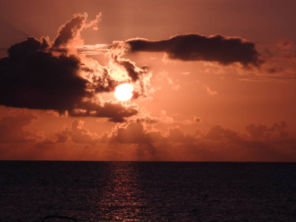 istock Sunset in the Cayman Islands by the Ocean 1127617087
