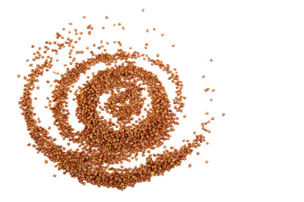 Wallpaper abstract composition of organic buckweat .Grain contains no gluten, it may be eaten by people with gluten-related disorders. Natural useful dietary product. Healthcare concept. Flat lay.Horizontal orientation.