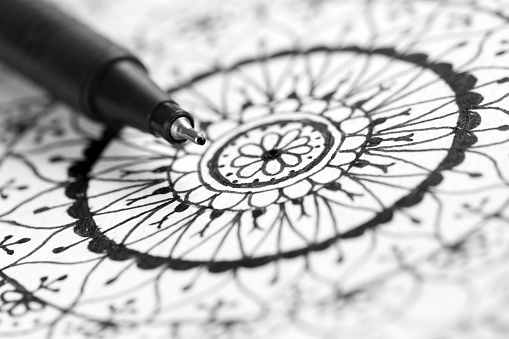 Mandala doodle hand drawing with pen, black and white