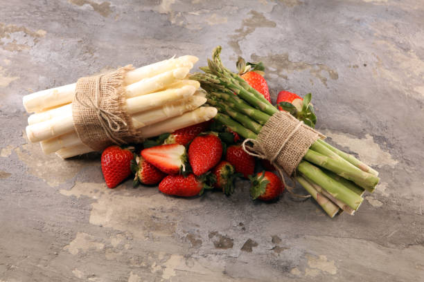 istock White and green asparagus with strawberries 1127619264