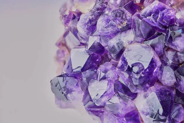 macro color photo of amethyst with focus stacking against white background