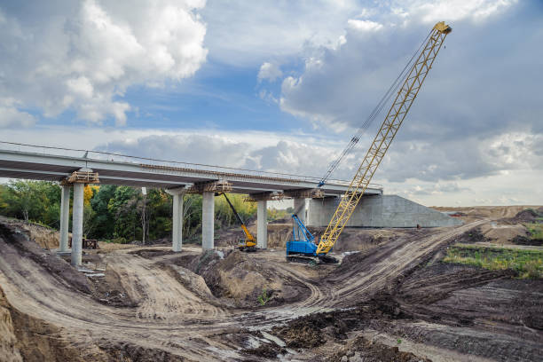 istock Lifting crane on the construction of a bridge 1127620441