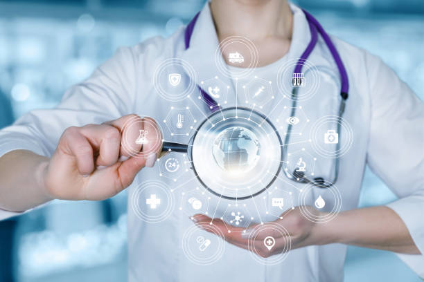 istock A doctor with a magnifier and global medical structure scheme. 1127621464
