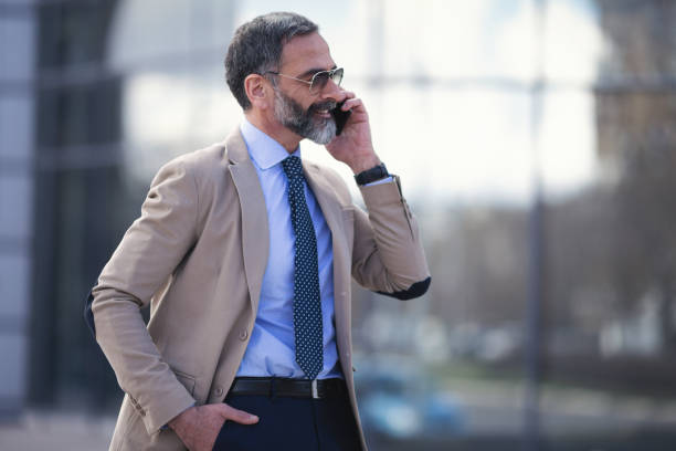 istock Senior businessman in the city using technology on the move 1127623820