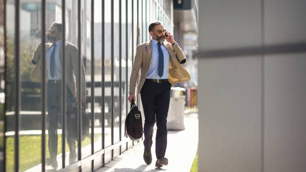 istock Senior businessman in the city using technology on the move 1127623846