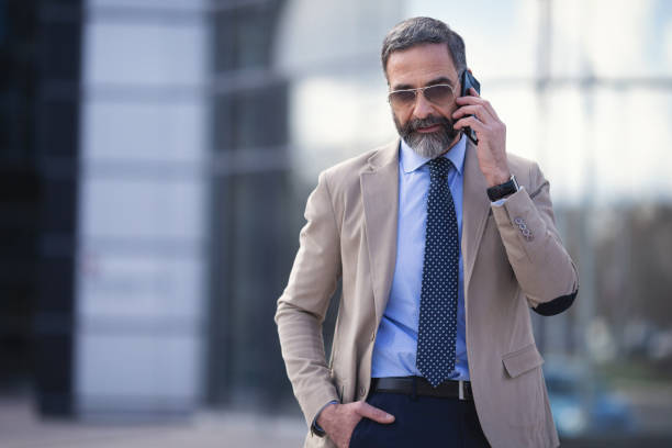 istock Senior businessman in the city using technology on the move 1127623931