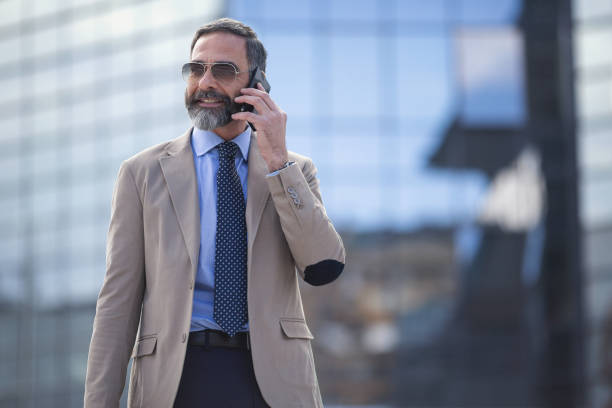 istock Senior businessman in the city using technology on the move 1127623969