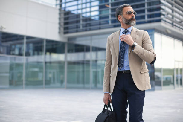 istock Senior businessman in the city using technology on the move 1127624111