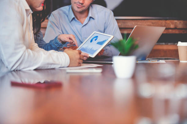 istock Business people working on financial data on a digital tablet. 1127625159