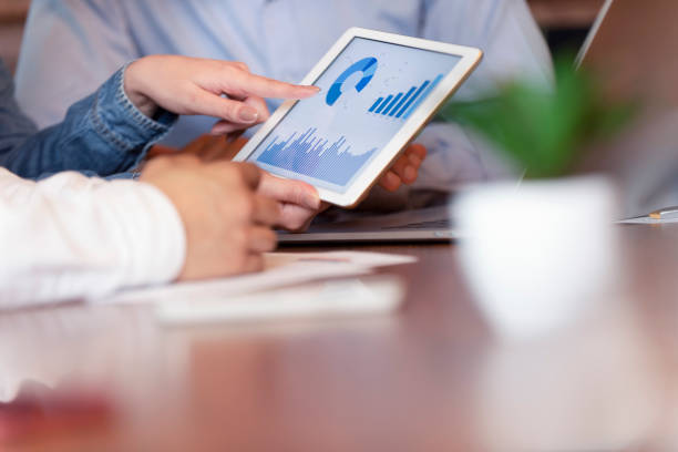istock Business people working on financial data on a digital tablet. 1127625160