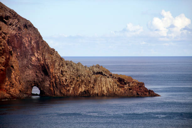 istock Madeira island volcanic cliff view, seascape, tunnel. 1127625422