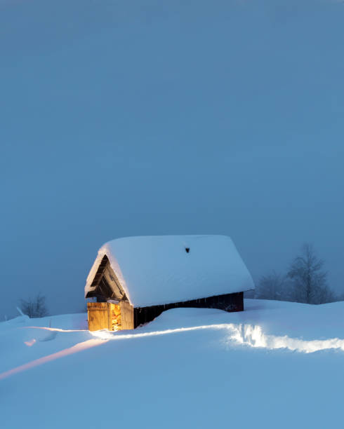 istock Fantastic landscape with snowy house 1127627335