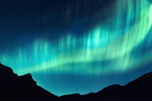 istock Northern lights in winter mountains 1127627340
