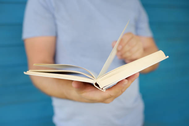 istock Close-up photo of mature man reading book 1127628021