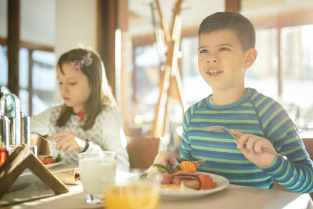 istock Family at breakfast in hotel restaurant 1127630730