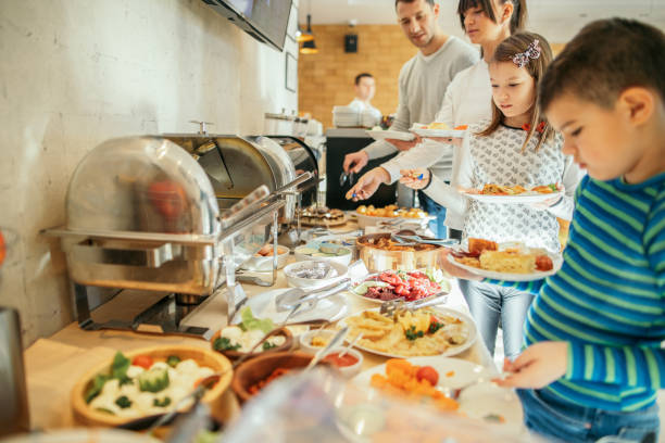 istock Family at breakfast in hotel restaurant 1127630776