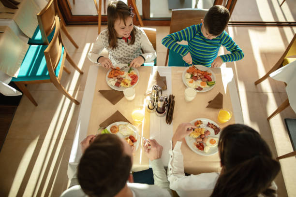 istock Family at breakfast in hotel restaurant 1127630792