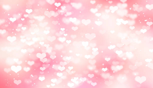 istock Pink blurred bokeh background with white hearts, Valentine's day, love, tenderness, romance 1127631441