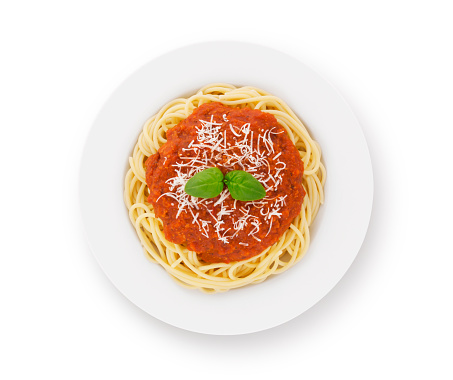 Spaghetti bolognese on plate with parmesan cheese and fresh basil isolated on white (excluding the shadow)