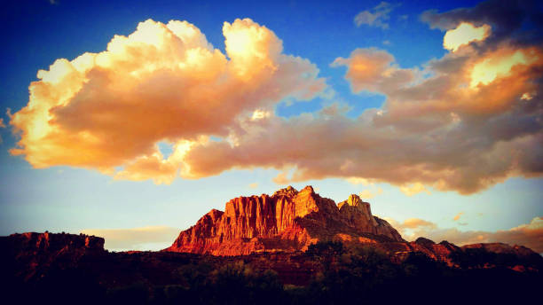 istock Dramatic sunset glow on cloud cap over Mt Kinesava in Zion National Park as seen on late summer day from Rockville Utah 1127632982