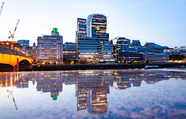 istock london bridge and skyscrapers reflecting at night 1127637065