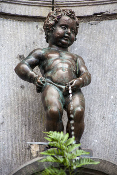 Manneken Pis in Brussels, Belgium Brussels, Belgium - August 5th 2012: A view of the historic Manneken Pis sculpture in the city of Brussels in Belgium. manneken pis statue in brussels belgium stock pictures, royalty-free photos & images