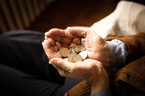 istock Female pensioner and money. 1127639414